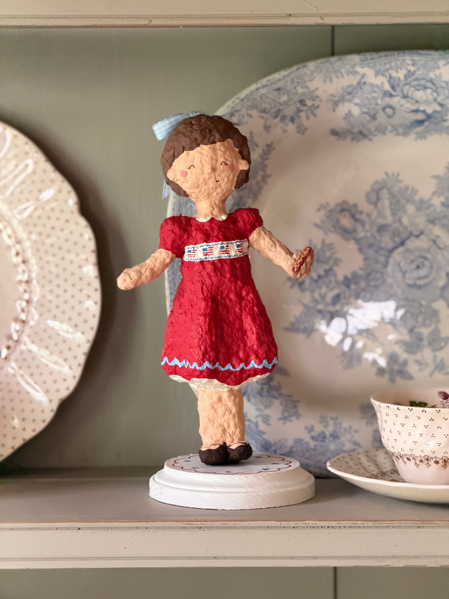 Maisie the Patriotic Girl paper mache figurine